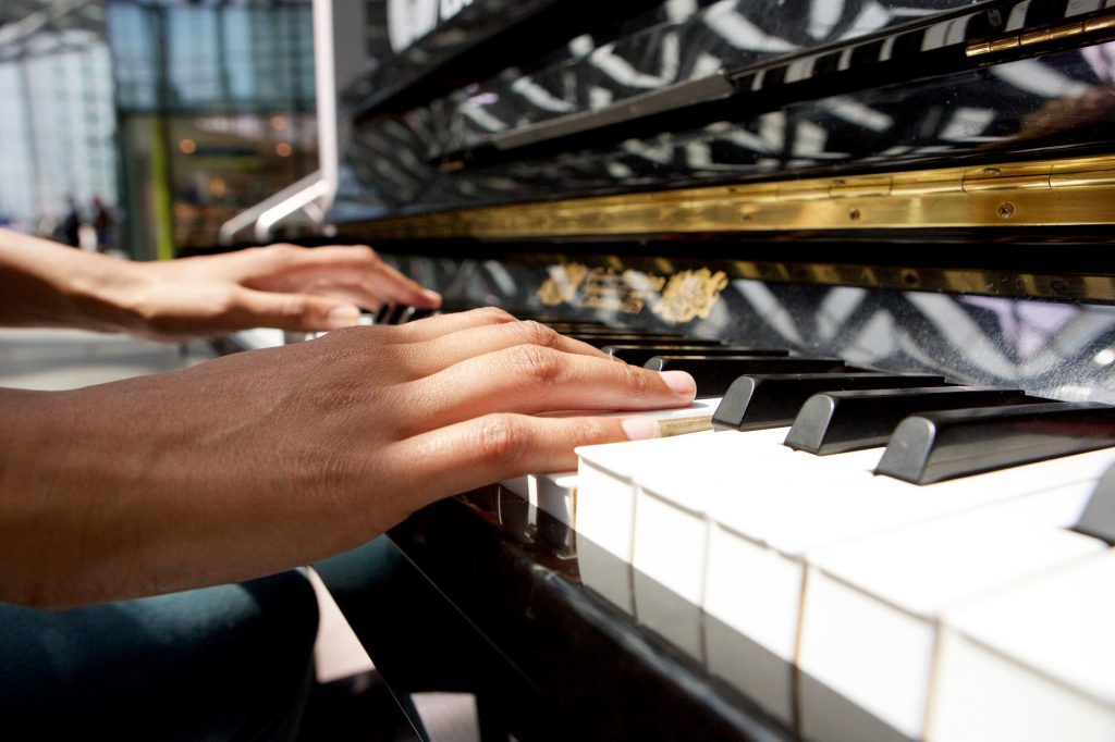 woman hands playing piano